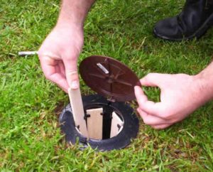 Termite baiting system installed Adding wooden termite bait to system